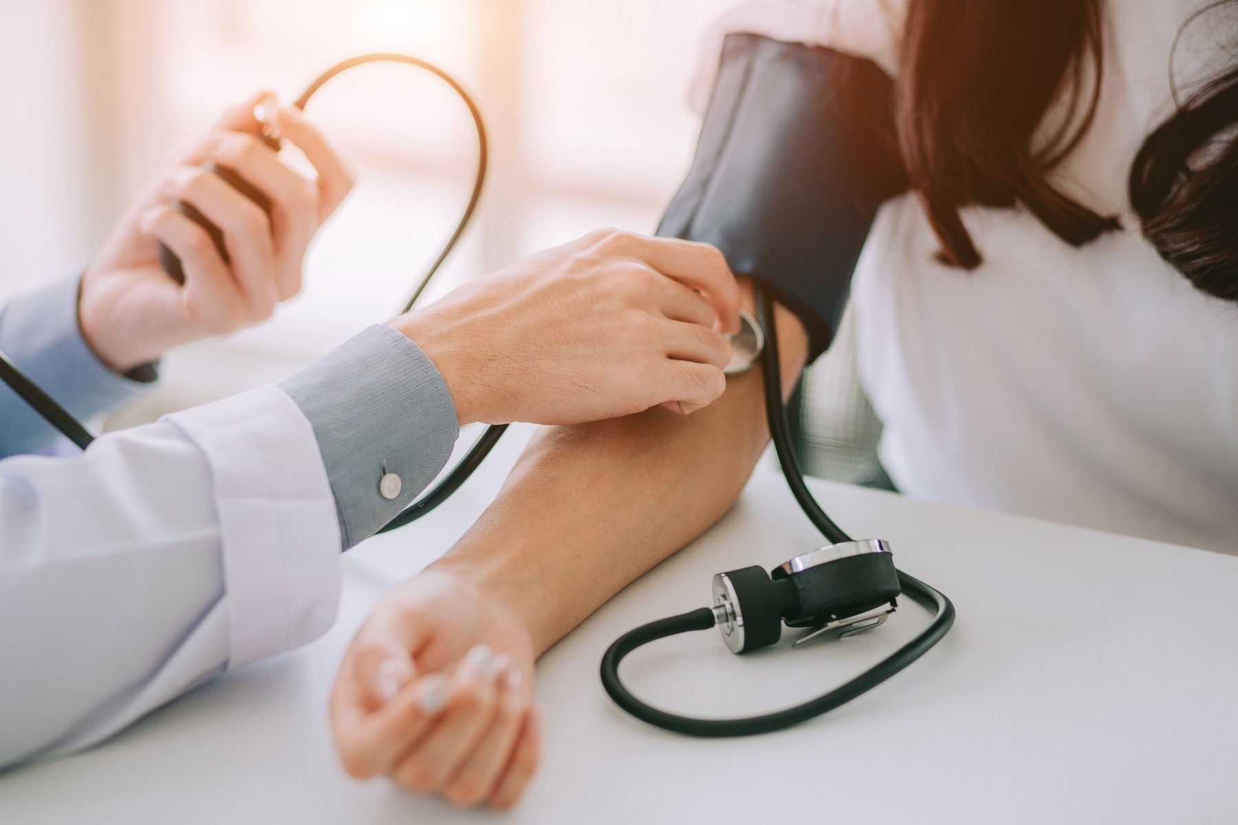 Doctor taking blood pressure 