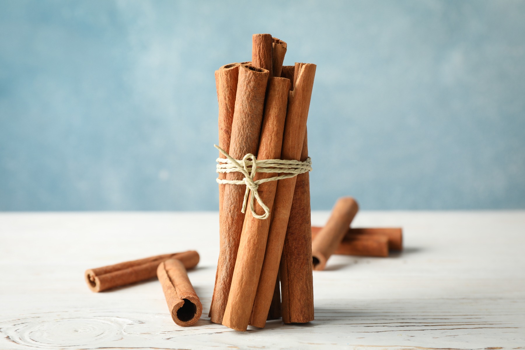 Cinnamon sticks with a piece of string wrapped around 